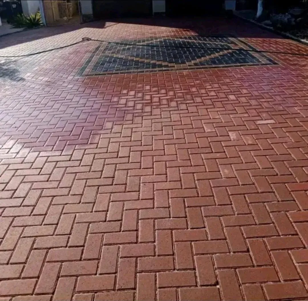 Red brick driveway in herringbone pattern