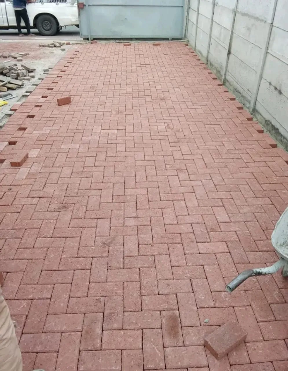 Red brick herringbone paving