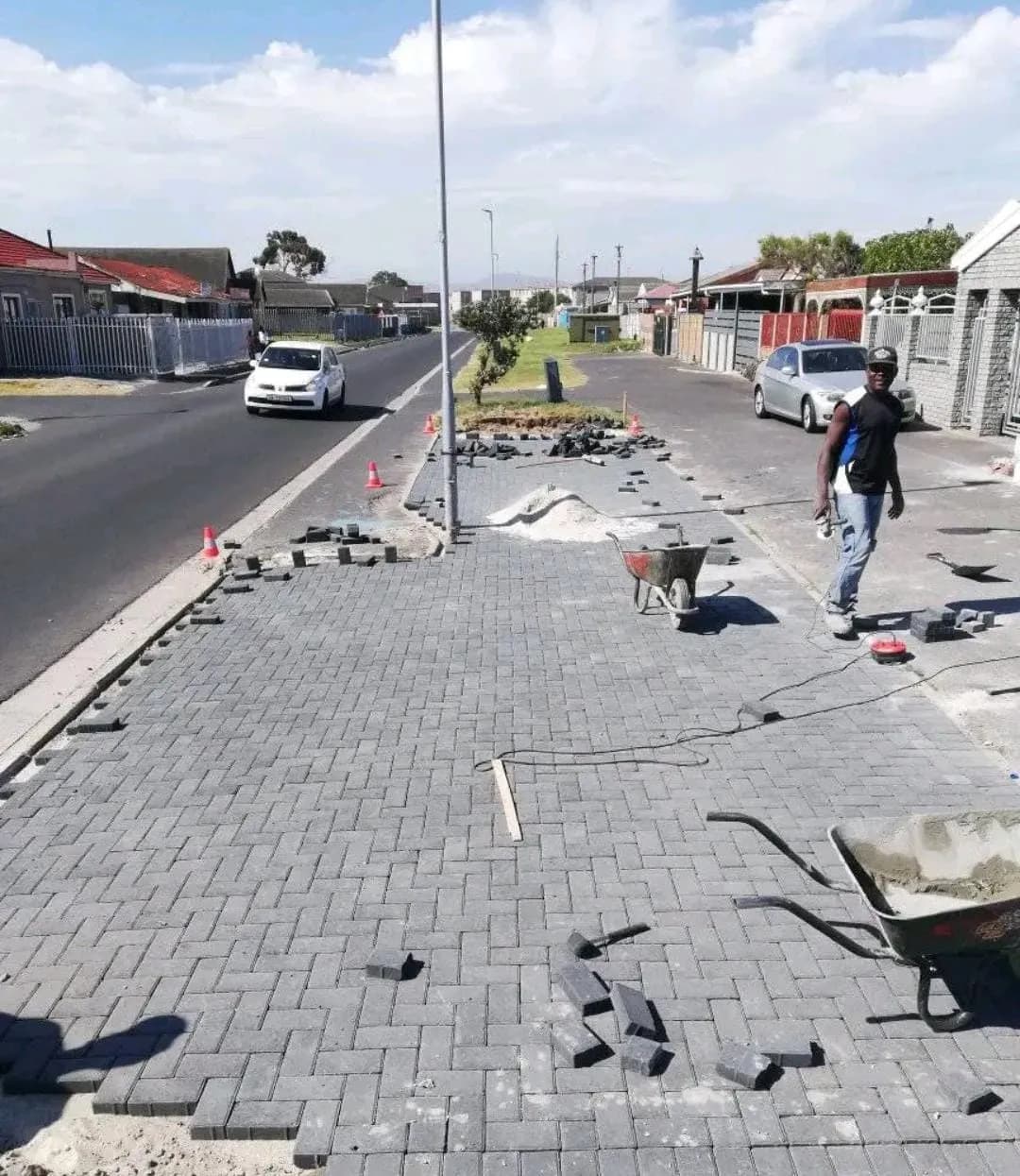 Street-front paving works with neat kerb line