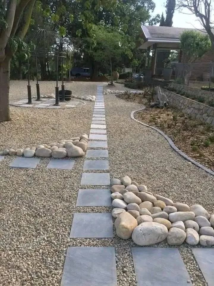 Pebble garden with paver stepping-stone path and river stones