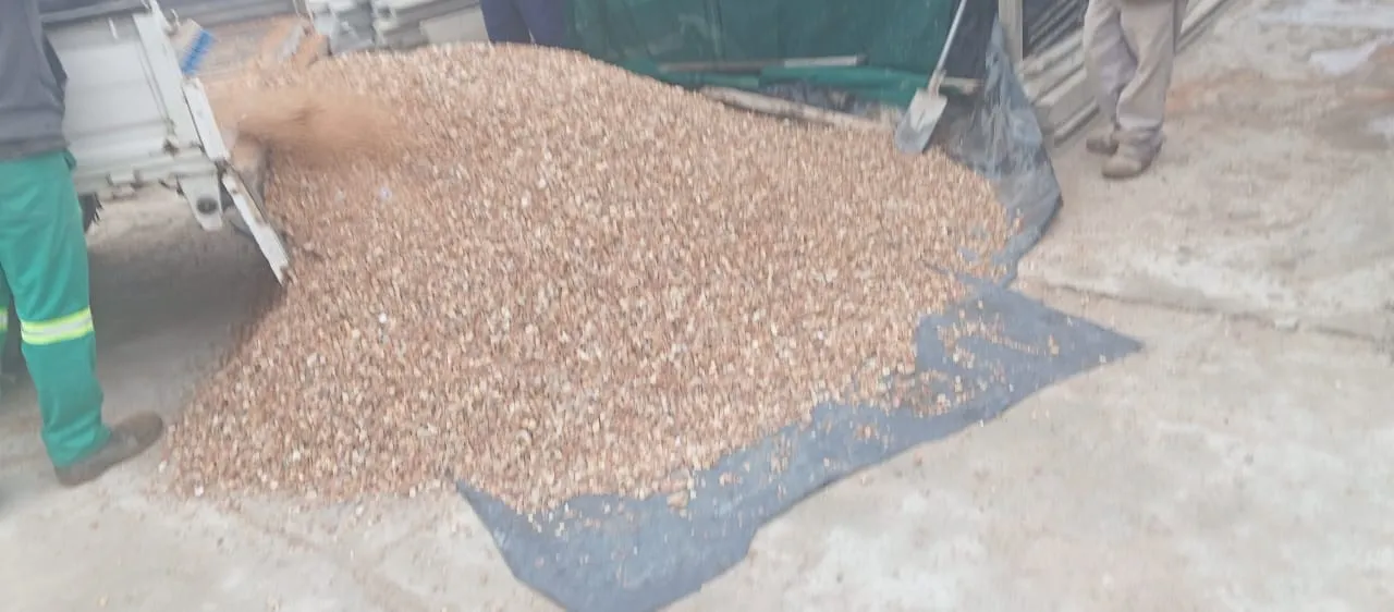 Pebbles spread over weed barrier